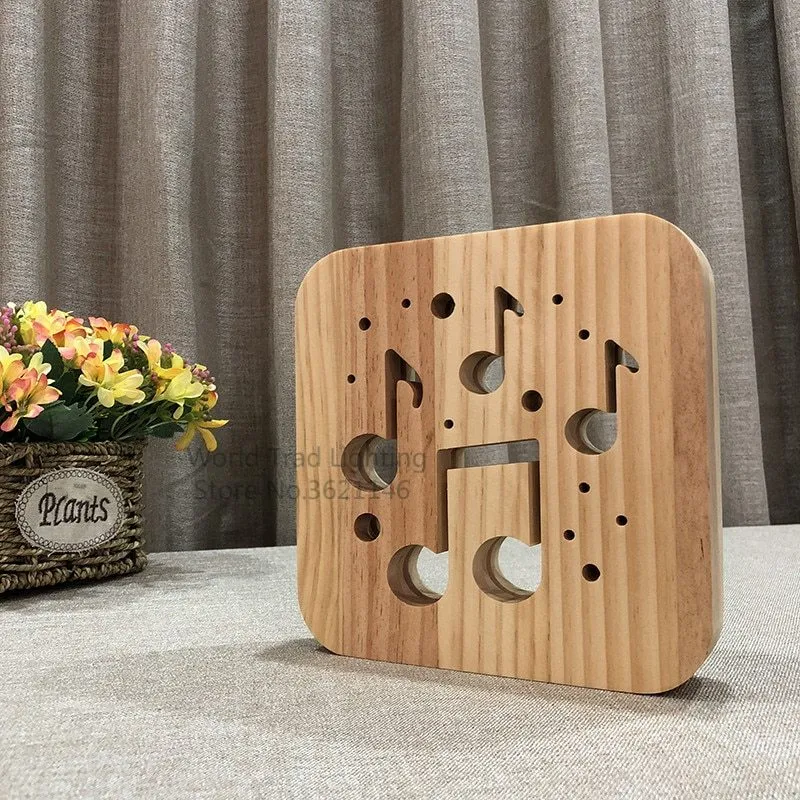 Square pine wood USB LED atmosphere lamp with warm white light on a table.