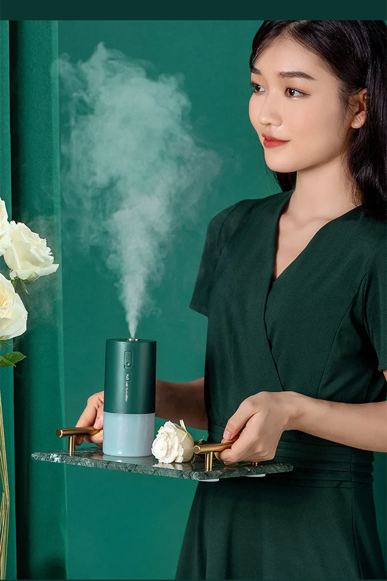 Blue columnar desktop humidifier with USB cable and water tank