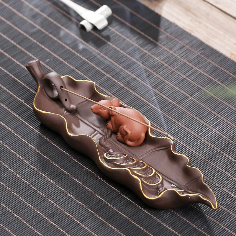 Purple clay ceramic lying incense burner with golden rat decorative design