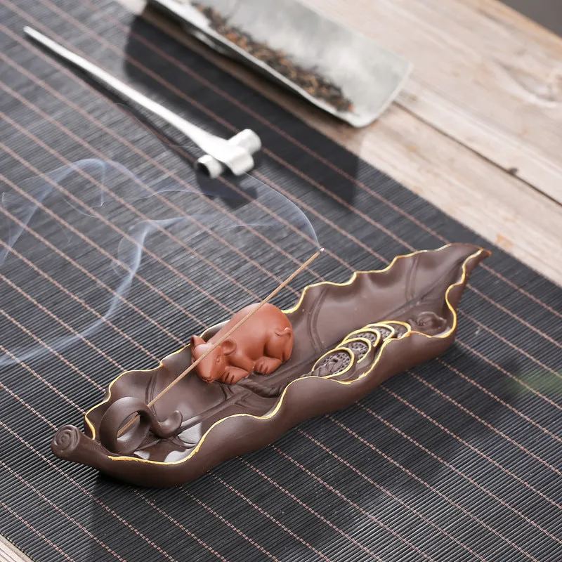 Purple clay ceramic lying incense burner with golden rat decorative design
