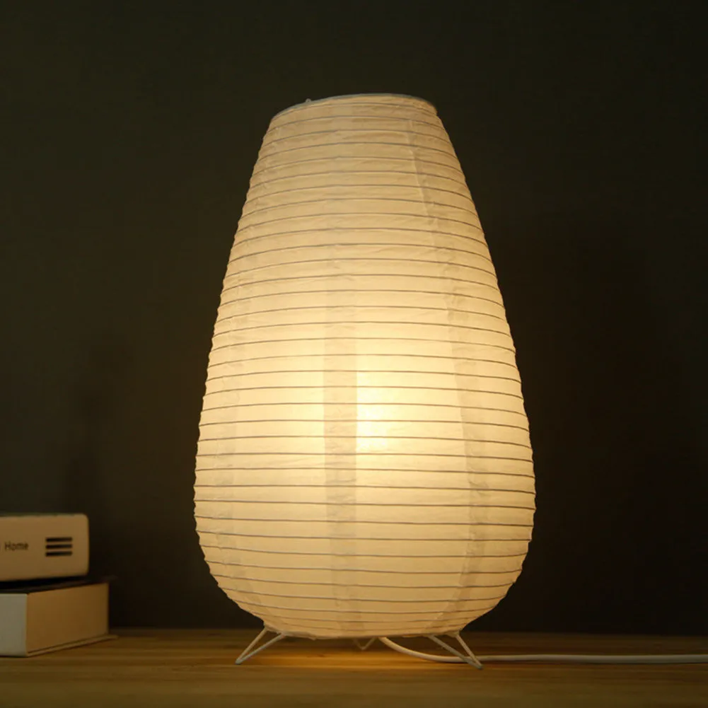 Traditional handmade rice paper table lamp with E14 bulb fitting on bedside table