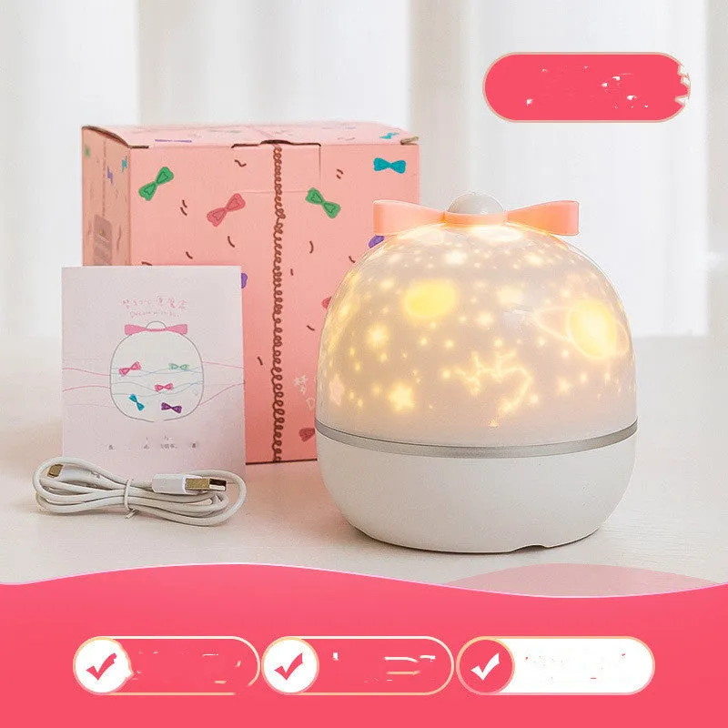 Rechargeable rotating starry projector light showing galaxy projection on a ceiling, available in six colour and style options.