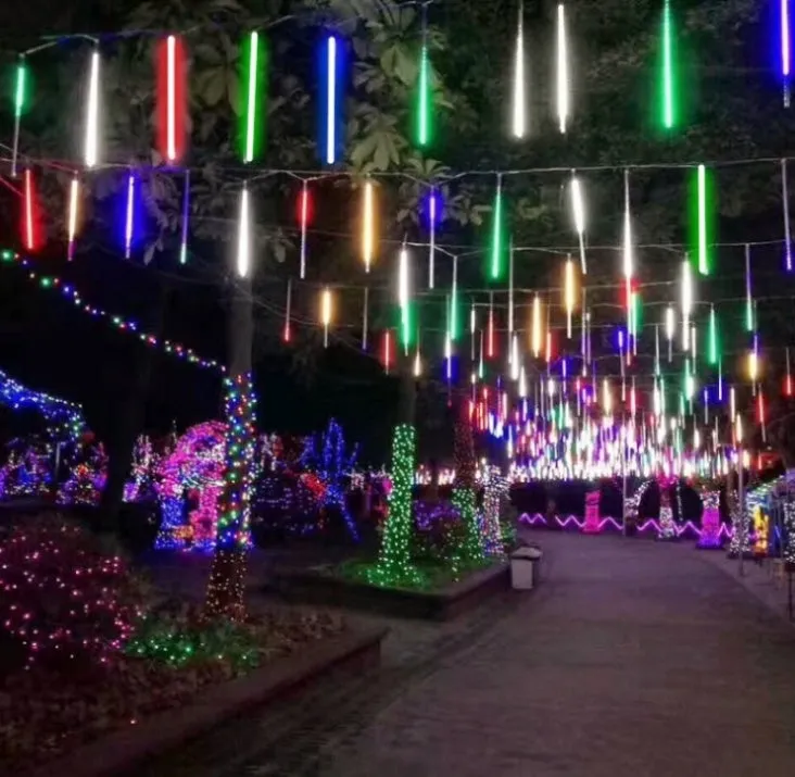 Waterproof LED meteor shower rain lights with multicolour effects in outdoor garden setting