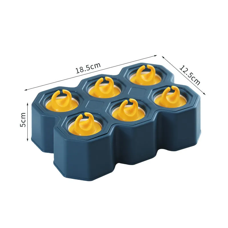 Brown plastic ice cube mold with honeycomb design and anti-drip edges
