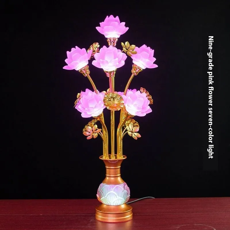 Coloured glaze pink and yellow LED lotus lantern for Buddha worship on an alloy stand.