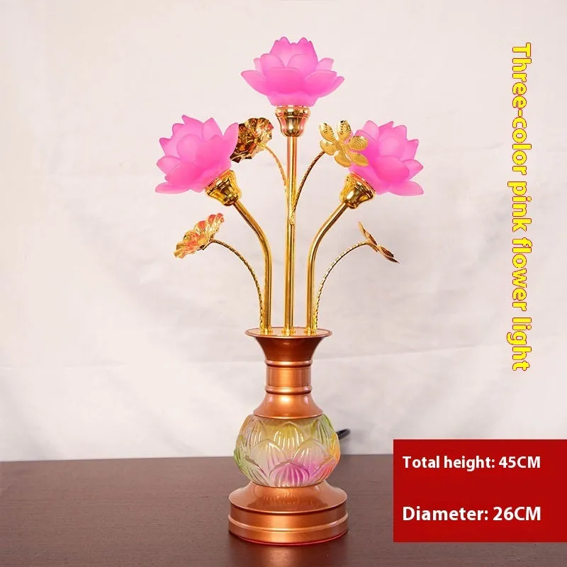 Coloured glaze pink and yellow LED lotus lantern for Buddha worship on an alloy stand.