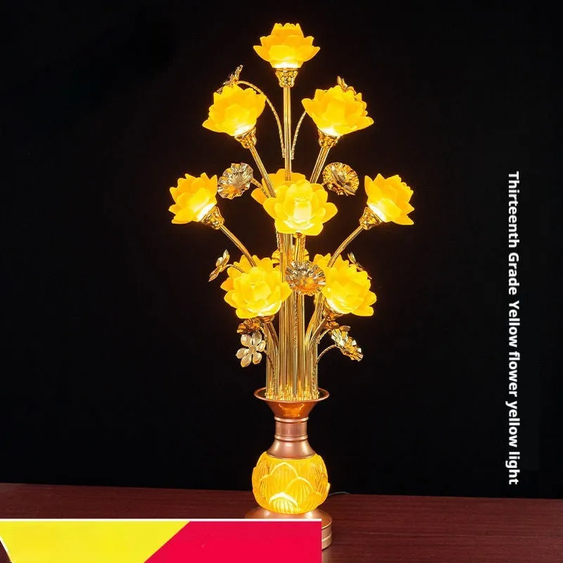 Coloured glaze pink and yellow LED lotus lantern for Buddha worship on an alloy stand.