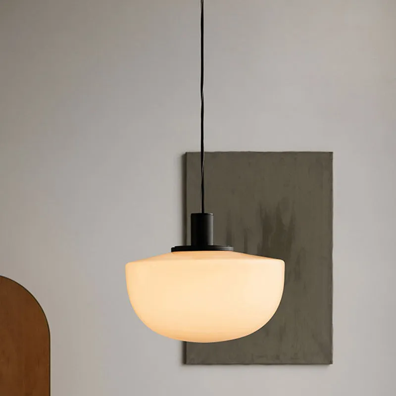 Simple modern glass pendant light with single-head droplight design in milky white finish