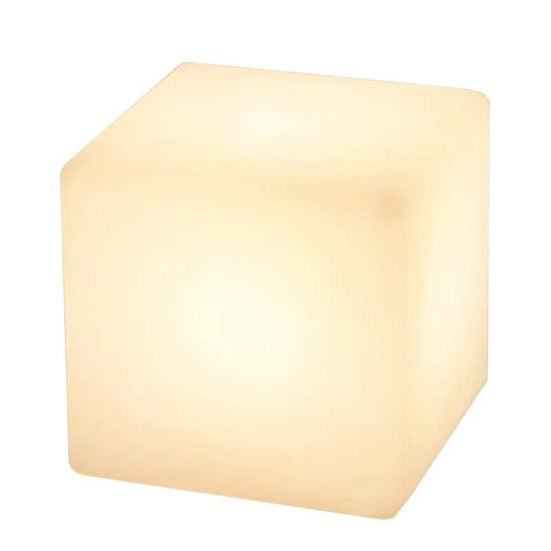 White square LED cube light stool on grass, showing modern design and waterproof build for outdoor use.