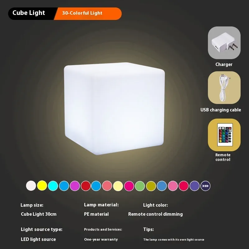 White square LED cube light stool on grass, showing modern design and waterproof build for outdoor use.