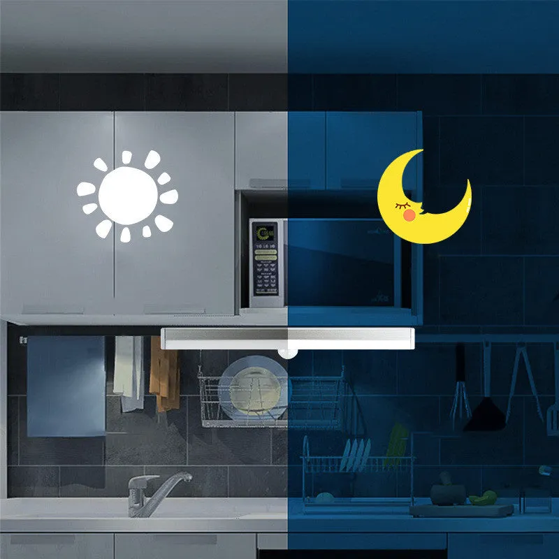 Black battery-powered LED strip light with motion sensor for cabinet or staircase installation.