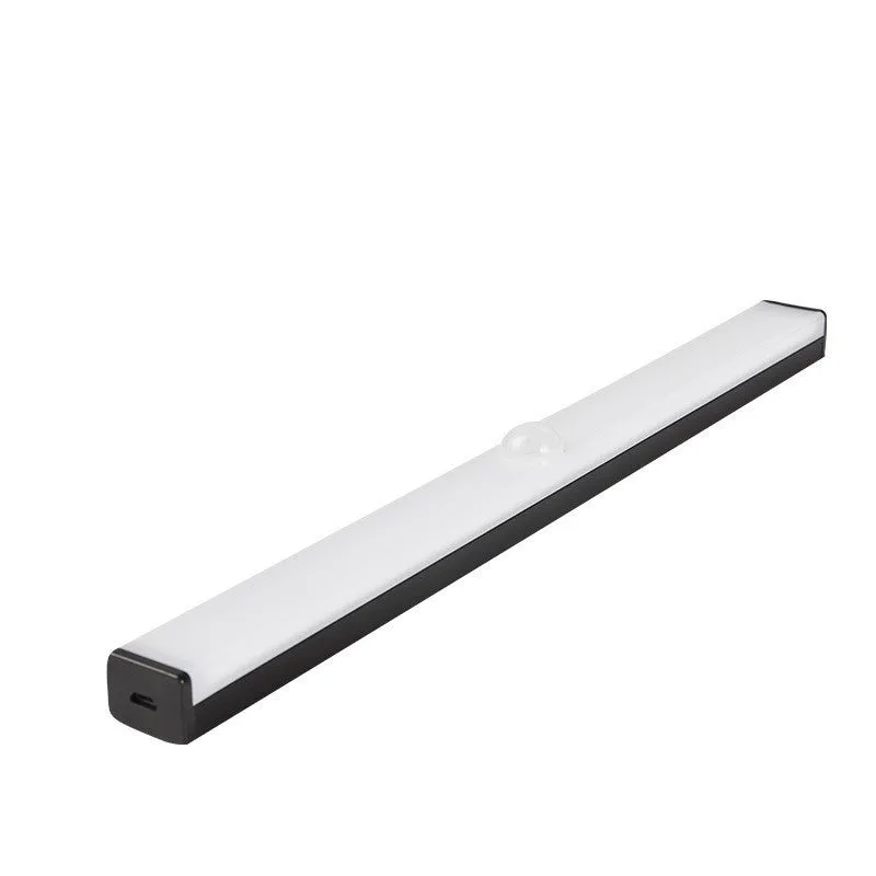Black battery-powered LED strip light with motion sensor for cabinet or staircase installation.
