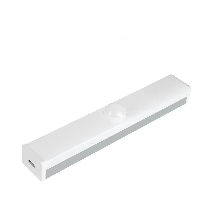Black battery-powered LED strip light with motion sensor for cabinet or staircase installation.