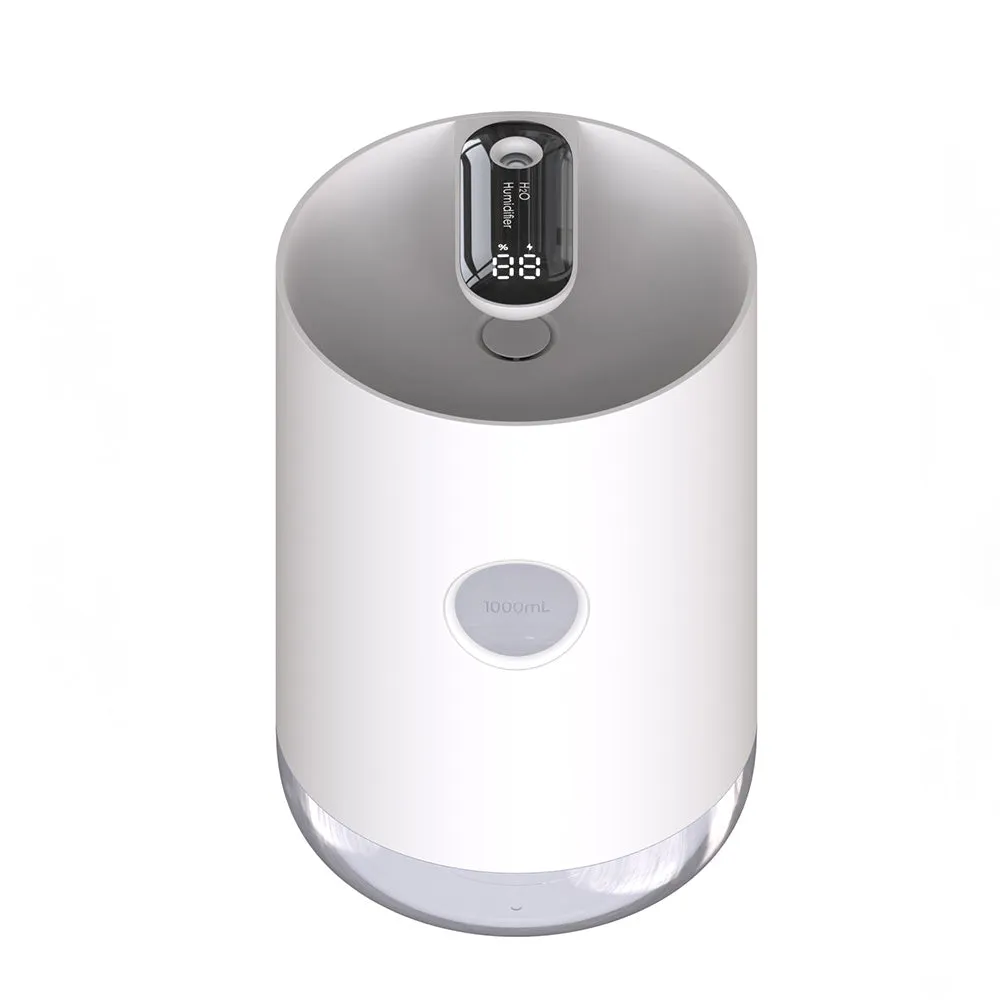 Blue wireless USB humidifier with water tank on a wooden desk next to a plant.