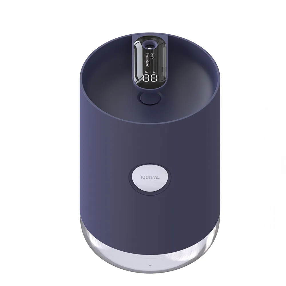 Blue wireless USB humidifier with water tank on a wooden desk next to a plant.