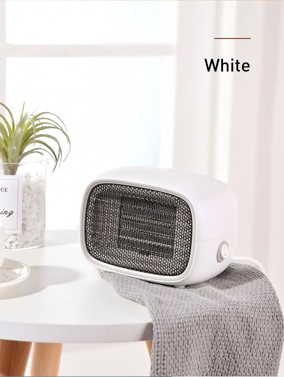 Compact green mini ceramic desk heater with metal grille, shown with dimensions.