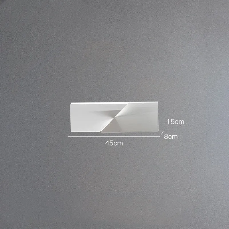 Minimalist rectangular wall lamp in matte white finish, shown in a living room setting.