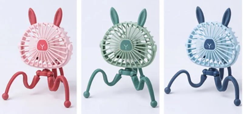 Pink portable USB rechargeable fan with animal design and clip attached to a stroller handle.