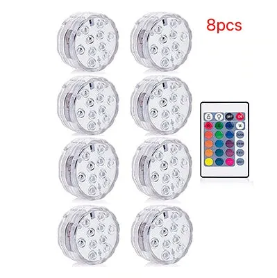 Round white battery-operated LED candle lamp suitable for submersible decoration.