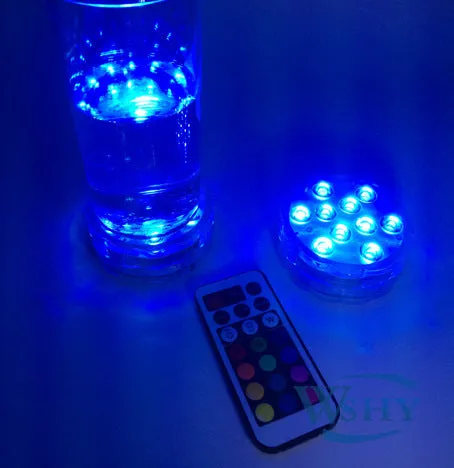 Round white battery-operated LED candle lamp suitable for submersible decoration.