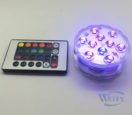 Round white battery-operated LED candle lamp suitable for submersible decoration.