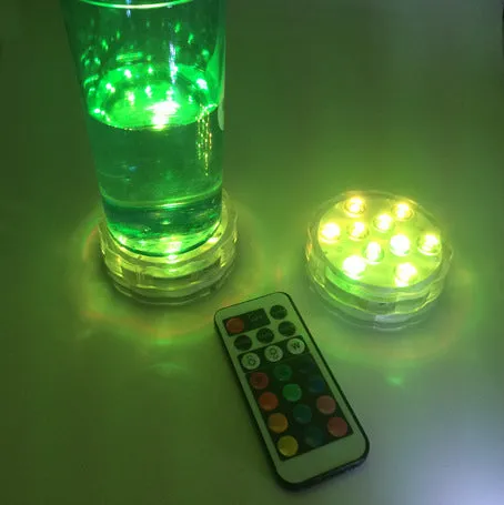 Round white battery-operated LED candle lamp suitable for submersible decoration.