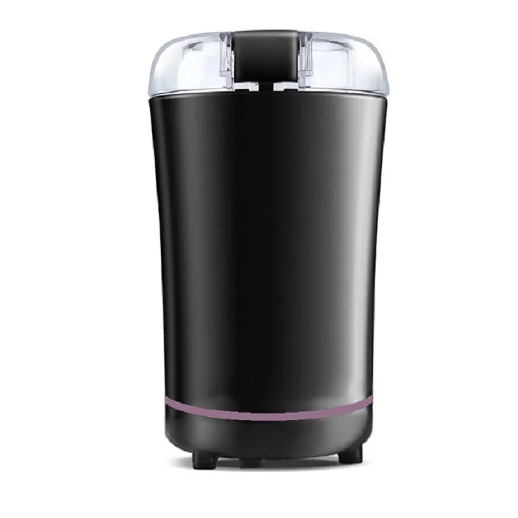 Black or purple mini electric grinder with stainless steel liner on a kitchen worktop