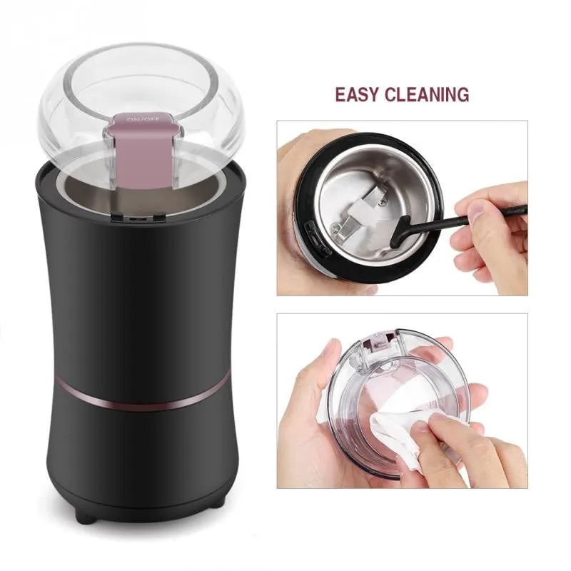 Black or purple mini electric grinder with stainless steel liner on a kitchen worktop