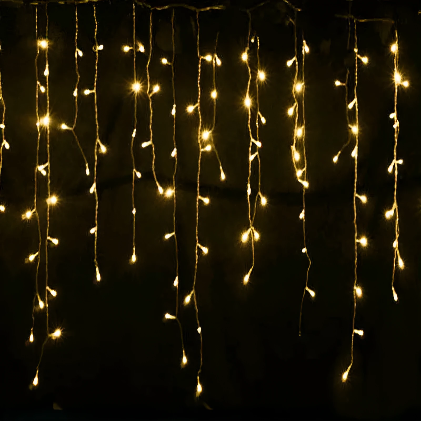 LED starry icicle light string with 96 lights on a 4-metre wire, showing three lengths of icicle drops in warm white illumination