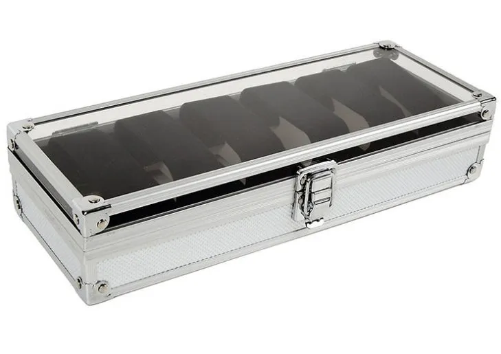 Brushed aluminium watch box holding six watches with a front jewellery storage bin.