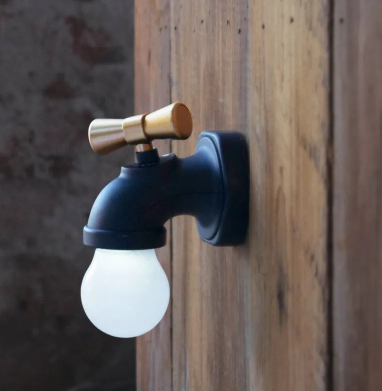 Black and white faucet-shaped USB rechargeable night lamp with sound activation feature