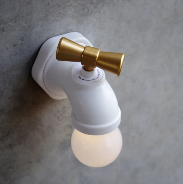 Black and white faucet-shaped USB rechargeable night lamp with sound activation feature