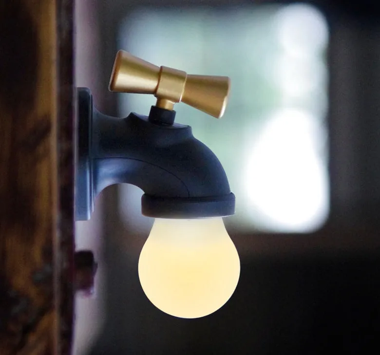 Black and white faucet-shaped USB rechargeable night lamp with sound activation feature