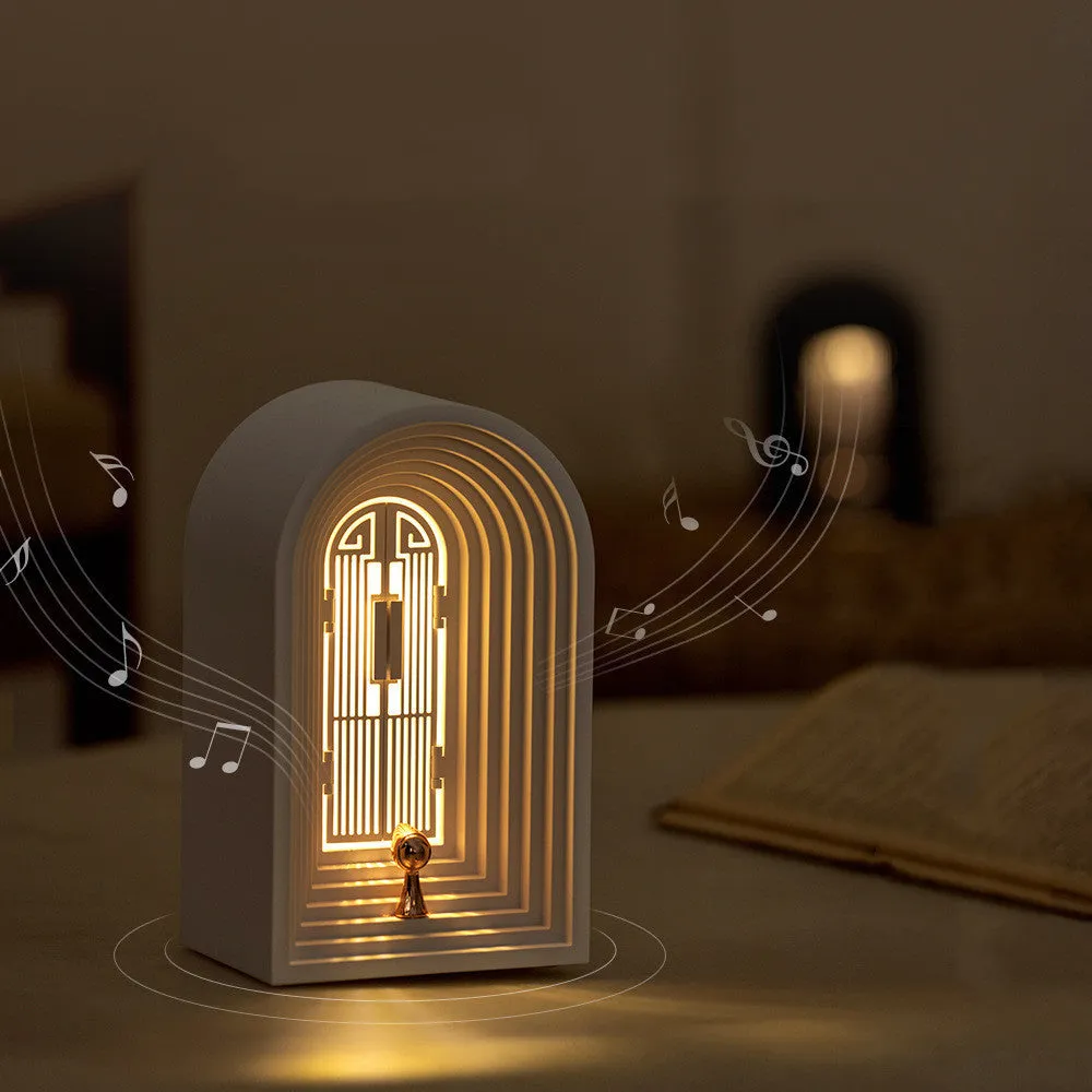 Nordic LED table lamp with Bluetooth speaker in white, plastic shade, compact bedside design