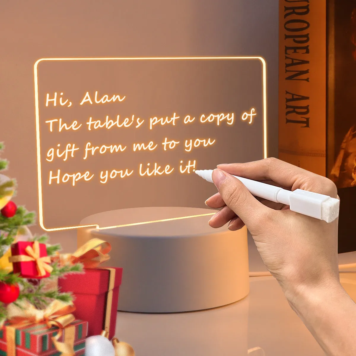 Heart-shaped LED light note board with warm yellow USB light and drawing pen on a desk