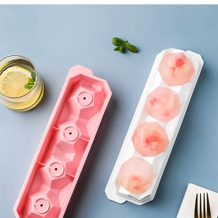 Flexible silicone ice tray showing large ice hockey, pentagon, and spherical mould designs in light blue.