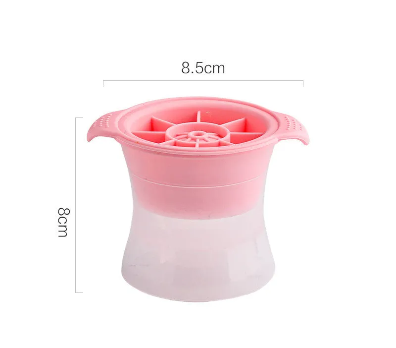 Flexible silicone ice tray showing large ice hockey, pentagon, and spherical mould designs in light blue.