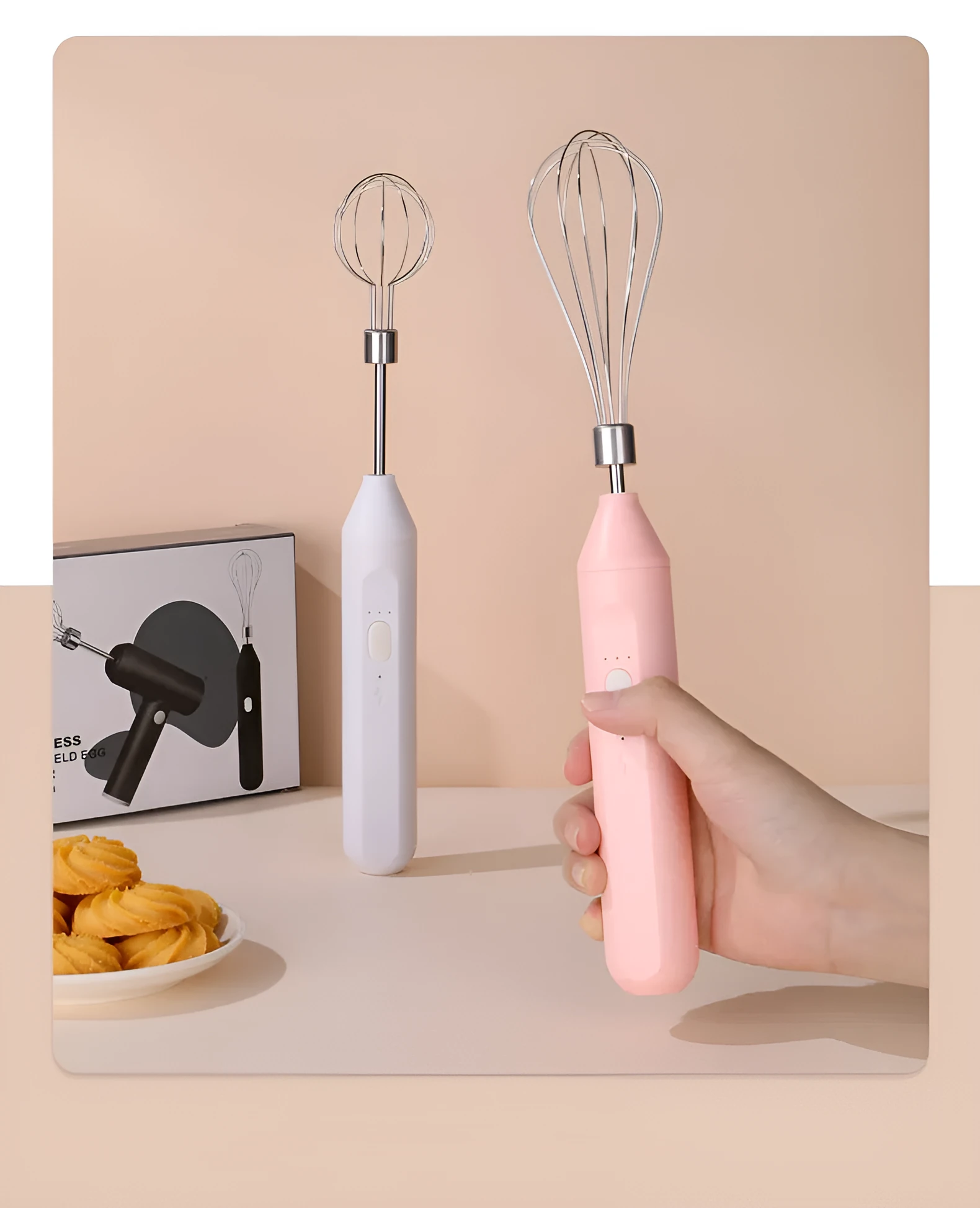 Hand-held wireless electric whisk in black and pink, with straight handle and stainless steel whisk attachment