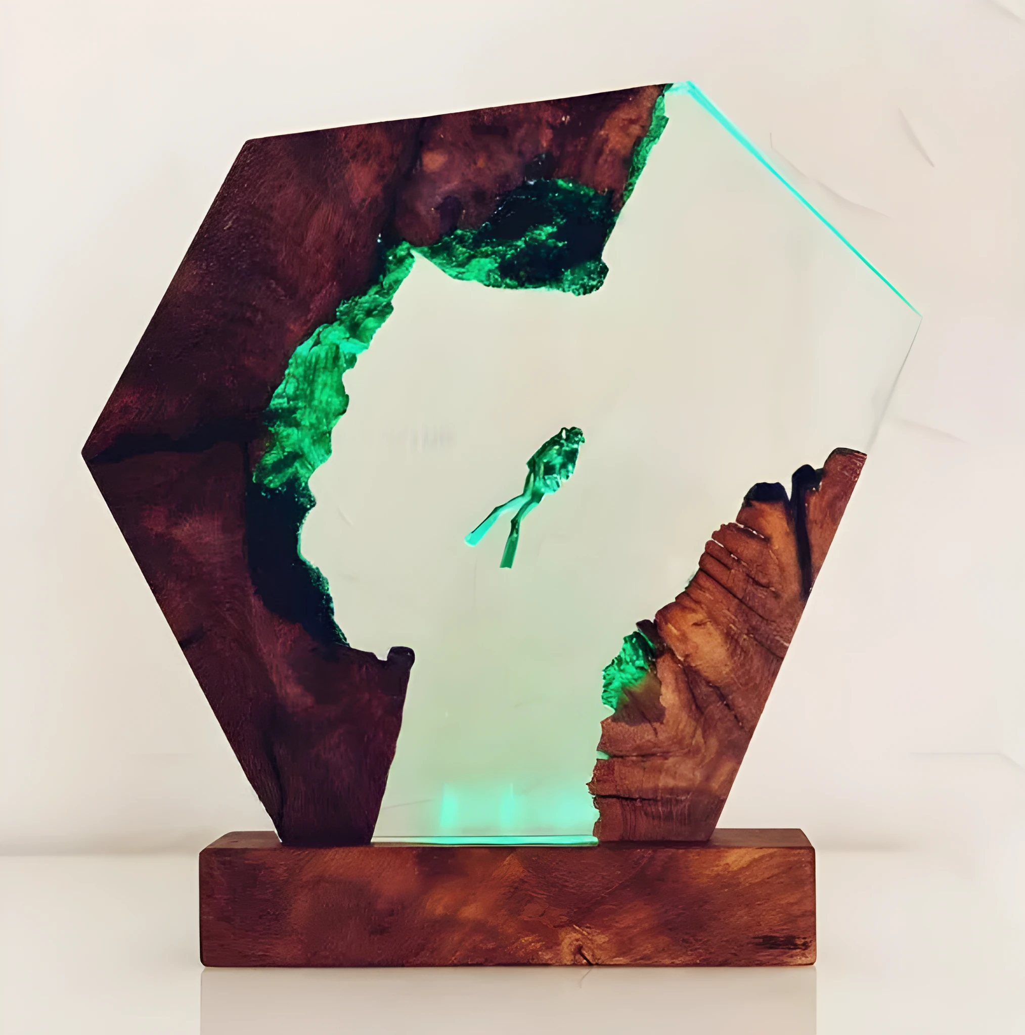 Resin luminous diver and humpback whale night light with USB cable on a shelf