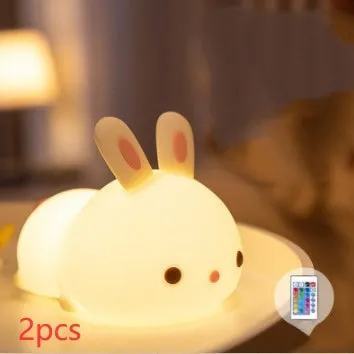 Rabbit silicone pat night light with seven-colour LED on a study desk