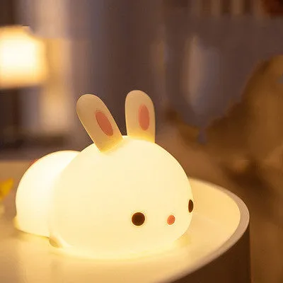 Rabbit silicone pat night light with seven-colour LED on a study desk