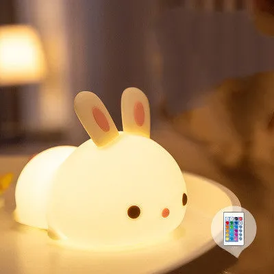 Rabbit silicone pat night light with seven-colour LED on a study desk