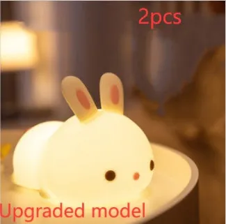 Rabbit silicone pat night light with seven-colour LED on a study desk
