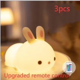 Rabbit silicone pat night light with seven-colour LED on a study desk