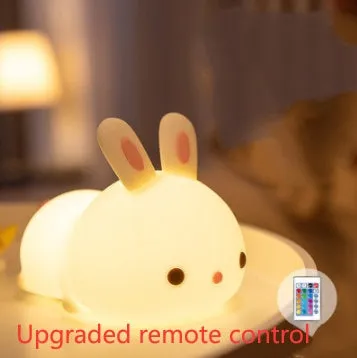 Rabbit silicone pat night light with seven-colour LED on a study desk
