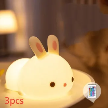 Rabbit silicone pat night light with seven-colour LED on a study desk