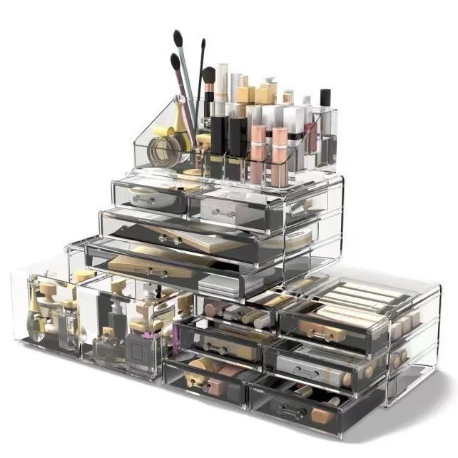 Acrylic three-layer cosmetics storage box in transparent finish with organised compartments on a dressing table