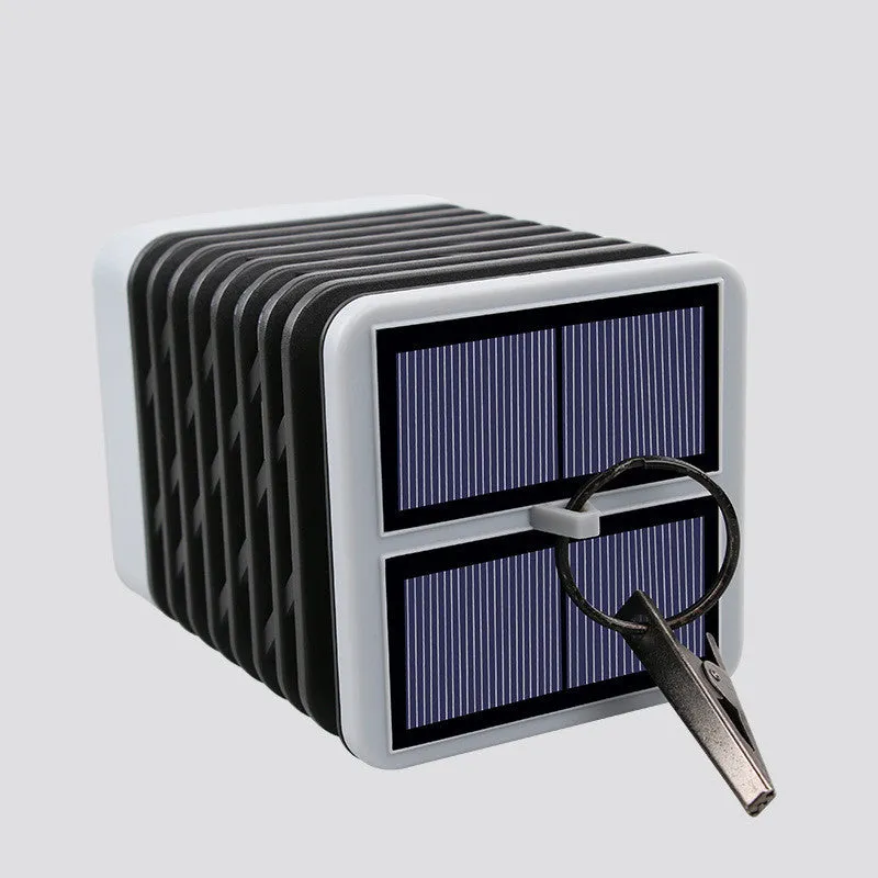 Solar candle flame lawn lamp with 75 yellow LEDs, IP55 rating, placed in a garden setting