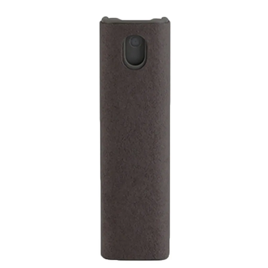 Small blue screen cleaner bottle with attached microfiber cloth on a table next to a smartphone