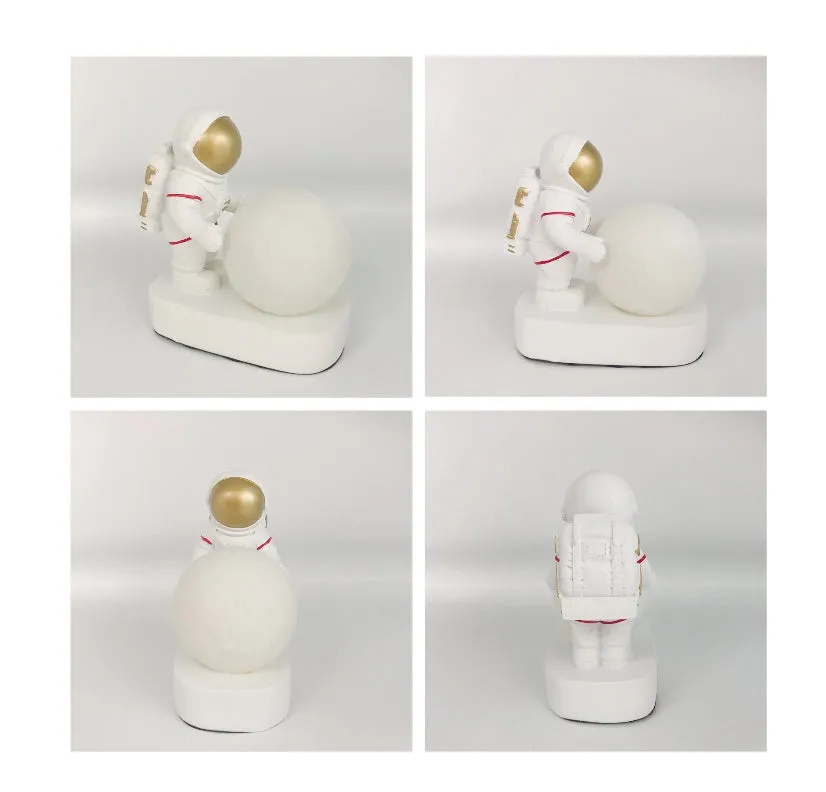 Gold resin astronaut night light on shelf, 14.5cm tall figurine with soft glow